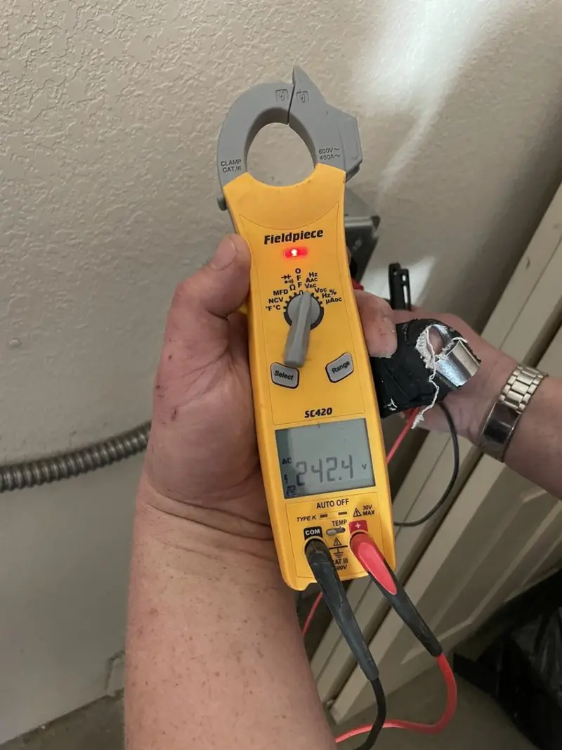 Voltage testing with clamp meter during Recessed Lighting Installation in Blairstown